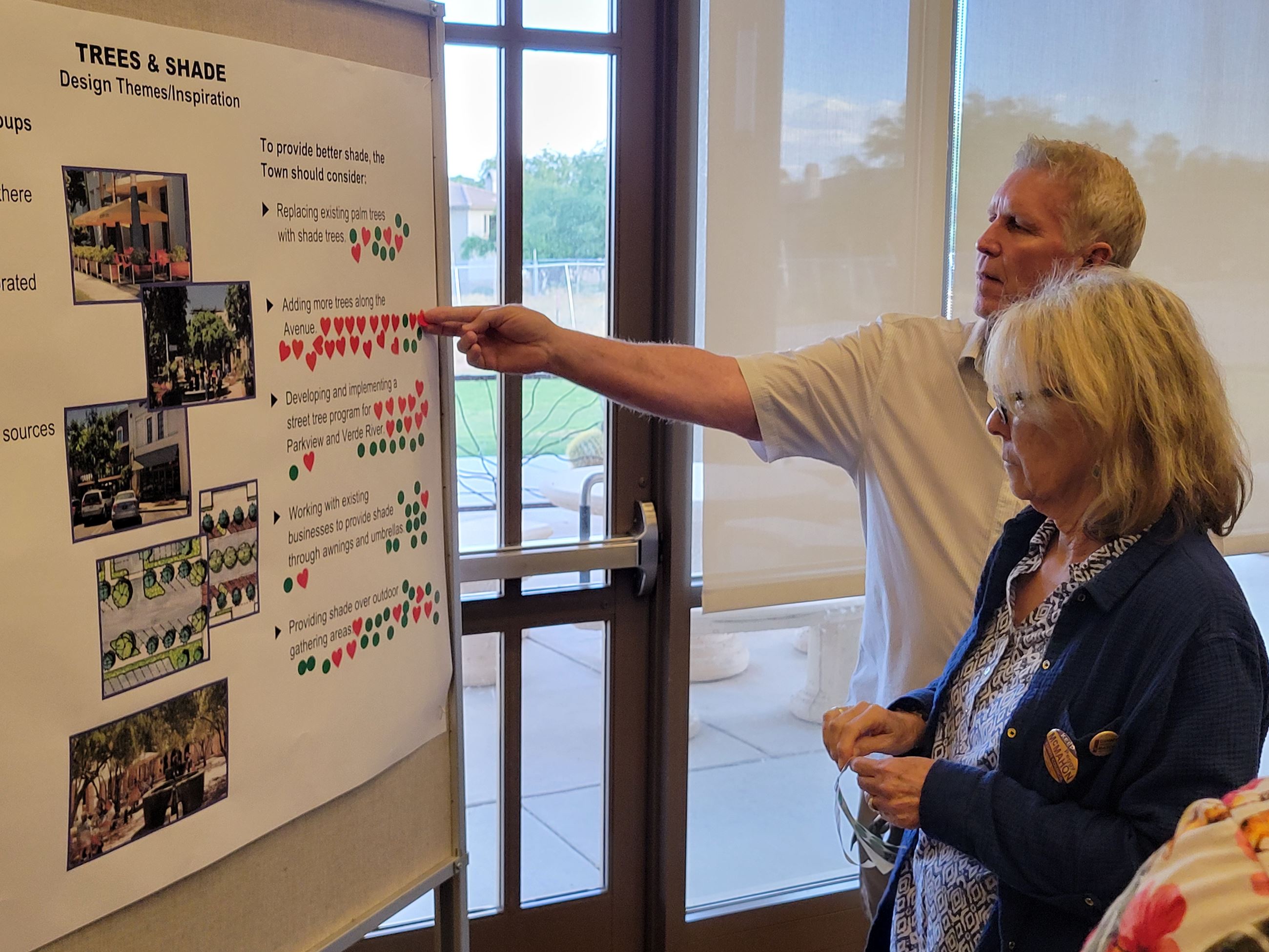 resident looking at the Downtown Strategy Boards