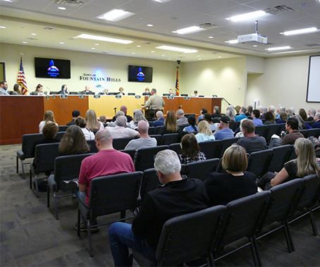 Wide shot of Council Chambers with attendees and Council 