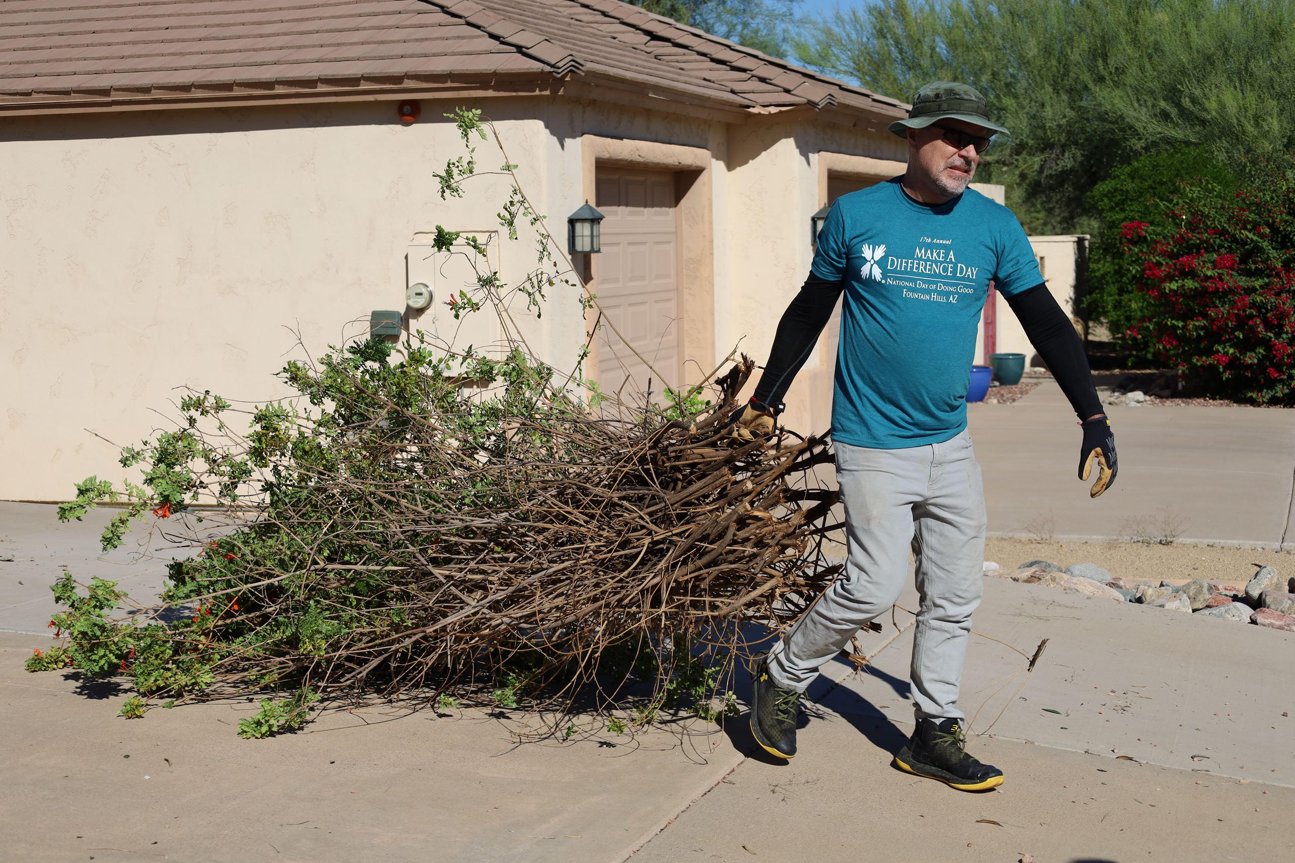 Guy dragging a tree